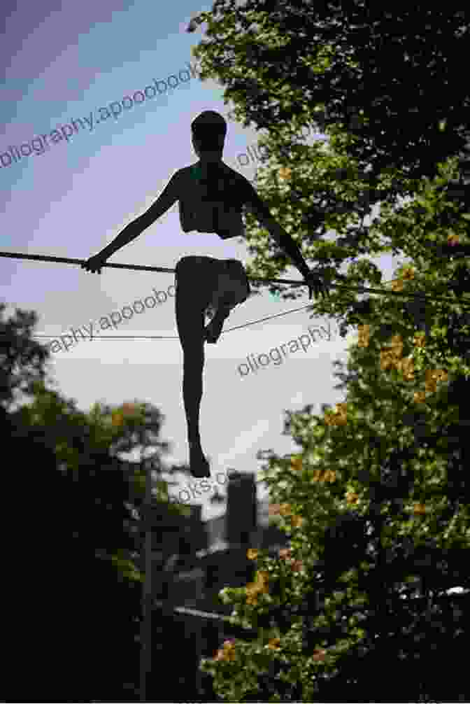 Jeremy Bullard Balancing On A High Wire With The City Skyline As The Backdrop, Showcasing The Urban Landscape Life On The Line Jeremy Bullard