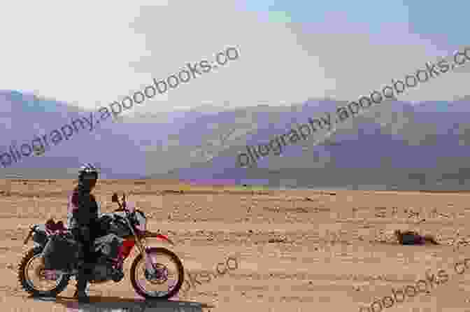 John Smith Riding His Motorcycle In The Namibian Desert A MOTORCYCLE ODYSSEY CAPE TOWN TO SINGAPORE