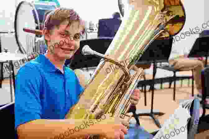 Student Playing The Tuba Joyfully Student Instrumental Course: Tuba Student Level 1