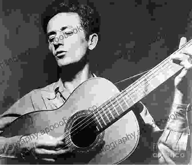 Woody Guthrie Playing Guitar, Smiling And Looking Up Woody Guthrie: An Intimate Life